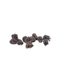 Load image into Gallery viewer, Small pile of dark brown dried fruit on a light gray background
