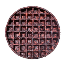 Load image into Gallery viewer, A round, dark brown waffle-patterned plate or tray with a deep grid design, isolated on a solid white background.