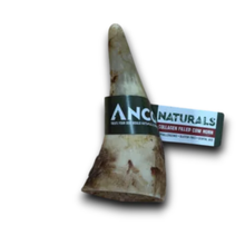Load image into Gallery viewer, A natural cow horn chew with a black and white ANCO Naturals label wrapped around it, set against a plain white background.