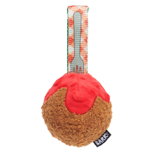 Load image into Gallery viewer, A plush dog toy shaped like a dessert, featuring a brown textured base resembling cake or bread, a bright red top section, and a patterned strap with a gray plastic fork printed on it. A small black tag with the brand name 'LARK' is visible at the bottom right.