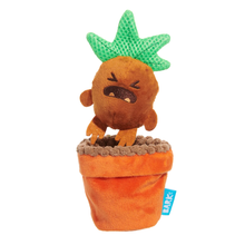 Load image into Gallery viewer, A plush toy shaped like a cartoon plant in a flower pot, with a brown round body, green leafy top, and orange pot, photographed on a plain white background. A small blue tag with the brand name BARK is attached to the pot.