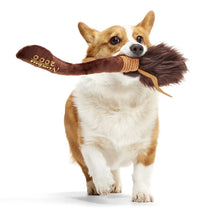Load image into Gallery viewer, Dog holding a large brown dog toy with a white background