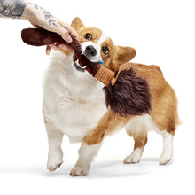 Load image into Gallery viewer, Dog playing with a plush toy on a white background
