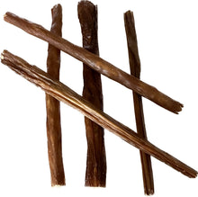 Load image into Gallery viewer, A photograph showing several sticks of beef spaghetti arranged on a plain background, intended as a dog treat.