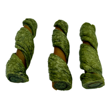 Load image into Gallery viewer, Three green herbal dog chew treats wrapped around natural brown bones, arranged vertically on a plain white surface.