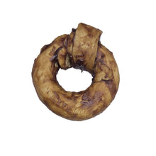 Load image into Gallery viewer, Brown Buffalo Collagen Ring on a white surface with a gloved hand in the background