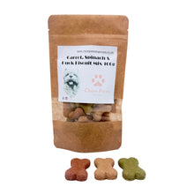 Load image into Gallery viewer, A stand-up kraft paper pouch labeled 'Chow Paws' containing carrot, spinach, and luck biscuit mix, with three bone-shaped dog treats placed in front on a white surface.