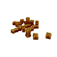 Load image into Gallery viewer, Small pile of brown dog treats on a white surface