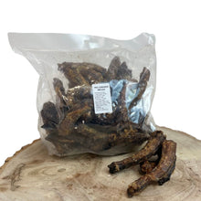 Load image into Gallery viewer, A clear plastic bag containing dried chicken neck pieces on a wooden surface.