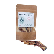 Load image into Gallery viewer, Duck foot treat in front of a brown packaging with a label on a white background