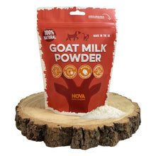 Load image into Gallery viewer, Red package of goat milk powder on a wooden stand with visible powder