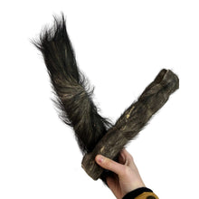 Load image into Gallery viewer, Hand holding a long, dark Hairy Jumbo Buffalo Rolls against a white background