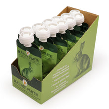 Load image into Gallery viewer, A cardboard display box holding multiple green Rabbit Paste pouches with white caps, photographed on a clean white background.