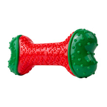 Load image into Gallery viewer, A red and green dog chew toy with a textured, bubbly surface and raised nubs on the ends, shown on a plain white background.