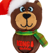 Load image into Gallery viewer, Brown dog toy with a red hat, green scarf, and 'KONG Wubba' branding on a white background.