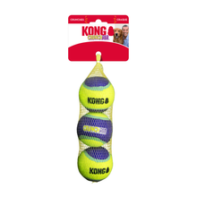 Load image into Gallery viewer, KONG Crunch Air dog toy set in a yellow mesh bag with a red and white hanging card, featuring three bright yellow tennis balls with blue and black patterned sections.