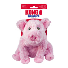 Load image into Gallery viewer, A pink plush pig toy from KONG Comfort, shown in its original retail blister packaging against a plain white background.
