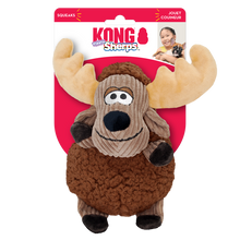 Load image into Gallery viewer, A plush moose-shaped dog toy with brown body, beige ears, and a black nose, packaged with KONG brand visible.