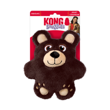 Load image into Gallery viewer, Kong Snuggles Squeaks dog toy shaped like a brown bear, attached to its original retail packaging card against a plain white background.