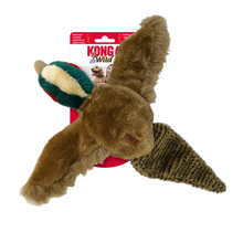 Load image into Gallery viewer, Kong Wild dog toy featuring a brown plush body with a green and cream striped tail and a brown-and-black patterned wing, shown with its retail packaging on a white background.