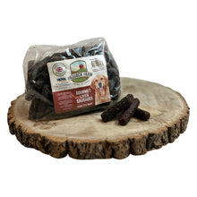 Load image into Gallery viewer, Packaged Nova Small Liver Sausages placed on a wooden surface, with several sausages visible outside the packaging.