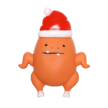 Load image into Gallery viewer, An orange cartoon chicken-like figure wearing a red Santa hat with a white trim, shown against a plain white background.