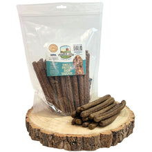 Load image into Gallery viewer, Package of dog treats with a label on a wooden surface