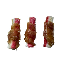 Load image into Gallery viewer, Three small rolled pieces of food wrapped in glossy caramelized onions and pink-red meat, arranged on a light speckled countertop.