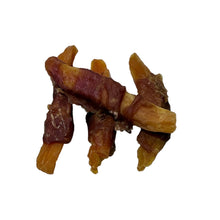 Load image into Gallery viewer, Three dried animal Sweet Potato Wrapped in Duck on a white surface