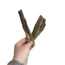 Load image into Gallery viewer, Hand holding two Nova Paddock Farm Tripe against a white background