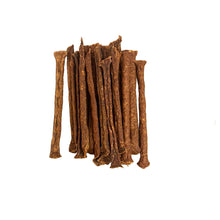Load image into Gallery viewer, Brown dog treats on a white background