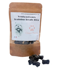 Load image into Gallery viewer, A stand-up kraft paper pouch labeled 'Venison Ecnes Training Treats 10Cts' with a white front label showing a dog photo and pink paw print, with several dark treats placed in front on a white surface.