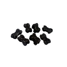 Load image into Gallery viewer, A small group of dark brown to black bone-shaped beads or charms scattered on a plain white surface.