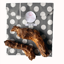 Load image into Gallery viewer, Two dried chicken necks on a polka dot packaging with 'Chew Paws' branding.