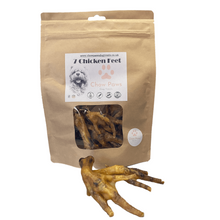 Load image into Gallery viewer, Package of dog treats labeled '7 Chicken Feet' with two chicken feet in front on a white background