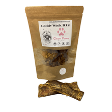 Load image into Gallery viewer, Dog treat package with a single treat in front on a white background