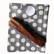 Load image into Gallery viewer, Dog treat package with a polka dot pattern and visible brand logo.