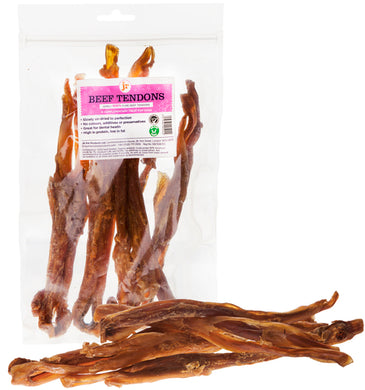 Packaged beef tendons as dog treats, both in a clear plastic bag and spilled out in front.