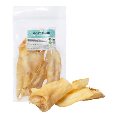 Packaged JR Goat Ears dog treats displayed alongside several air-dried goat ears outside the package.