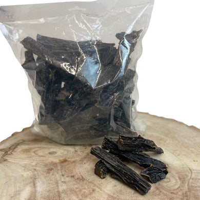Packaged beef liver strips for dogs, showing the product outside the packaging.