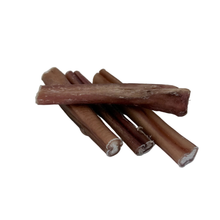 Load image into Gallery viewer, Stack of brown dog chew sticks on a white background
