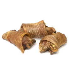 Load image into Gallery viewer, Three dried dog chew treats, likely beef jerky or jerky-style snacks, arranged on a plain white background.

