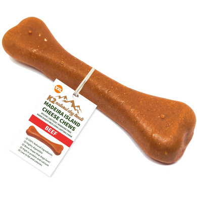 Dog chew treat shaped like a bone with a label on a white background