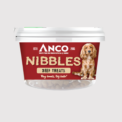 Container of Anco Nibbles beef treats with a dog on the label against a white background