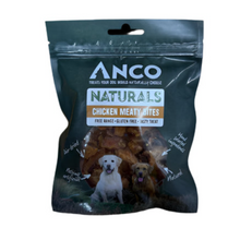 Load image into Gallery viewer, A package of Anco Naturals Chicken Meaty Bites dog treats, shown in a dark teal resealable bag with a clear window displaying the brown treats inside, and photos of two dogs on the front.
