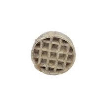 Load image into Gallery viewer, Round waffle-like object on a light gray background
