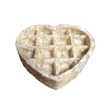 Load image into Gallery viewer, A heart-shaped novelty candle with a waffle pattern, made from cream-colored wax, isolated on a white background.
