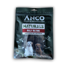 Load image into Gallery viewer, Anco Naturals Bully Biltong dog treats in a dark green resealable pouch with a white and red logo, featuring photos of two dogs on the front.

