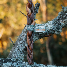 Load image into Gallery viewer, Dog leash with ANCO Naturals tag on a tree branch in a forest setting

