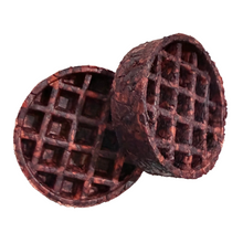 Load image into Gallery viewer, Two round, waffle-grid textured dog toys in a dark reddish-brown color, shown on a plain white background.
